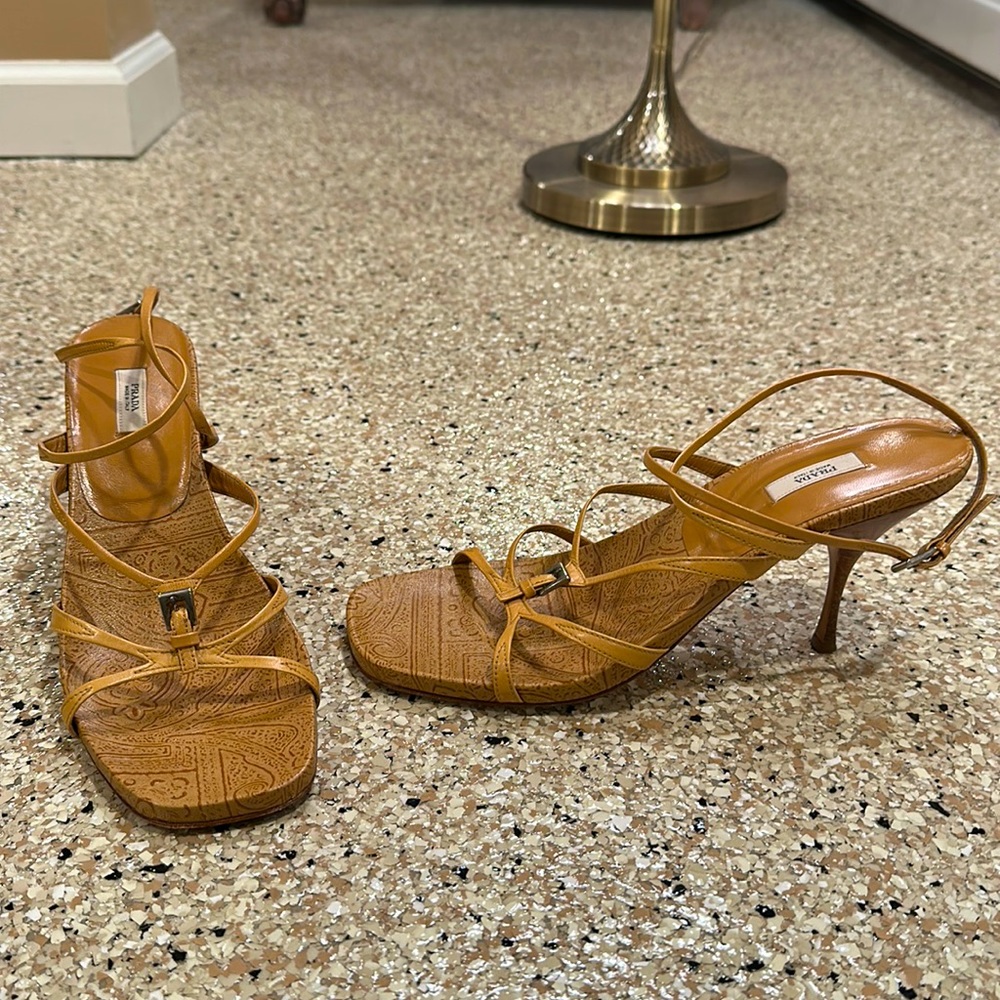 Prada heels with straps. Tan color, size 9. Previously worn and in great shape.